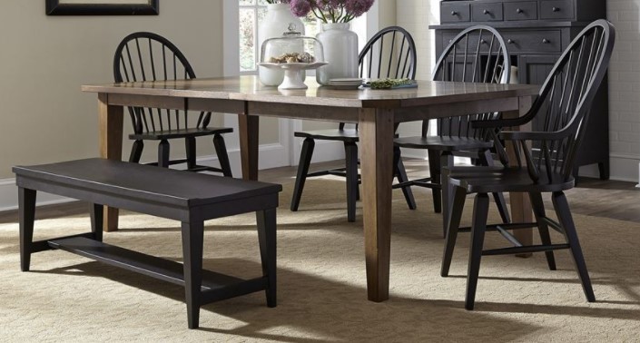 brown dining table with black chairs