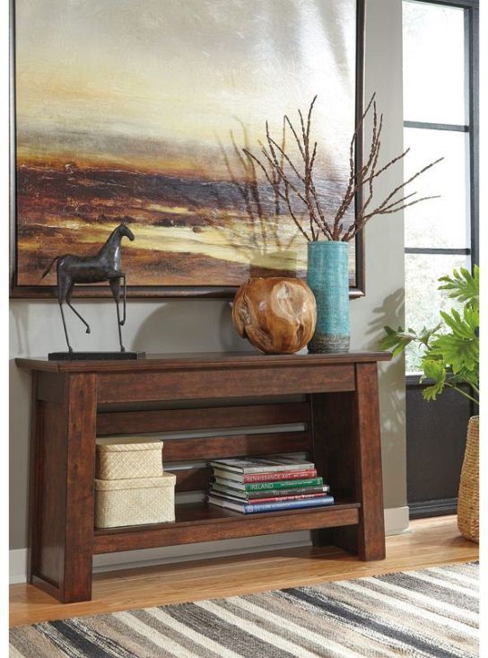 ignature Design by Ashley® Harpan Reddish Brown Sofa Table 1