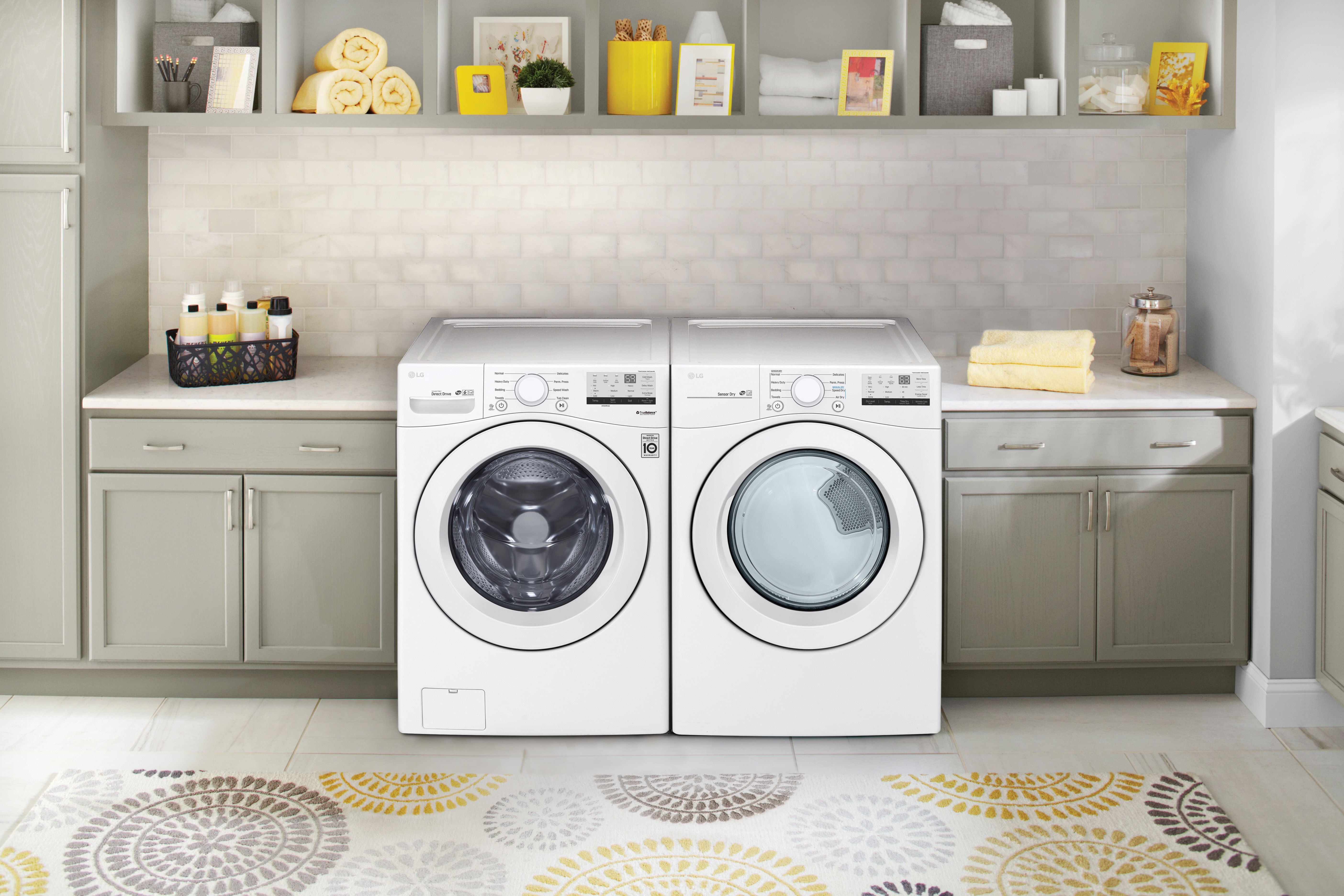 White LG top load washer and dryer in a laundry room