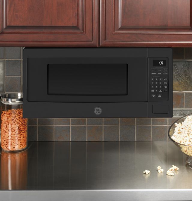GE Profile™ 1.1 Cu. Ft. Black Slate Countertop Microwave 3