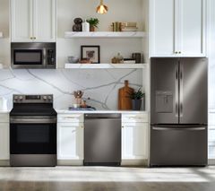 LG 4 Piece Kitchen Package with a 29 Cu. Ft. Capacity 3-Door French Door Refrigerator PLUS a FREE 10 PC Luxury Cookware Set