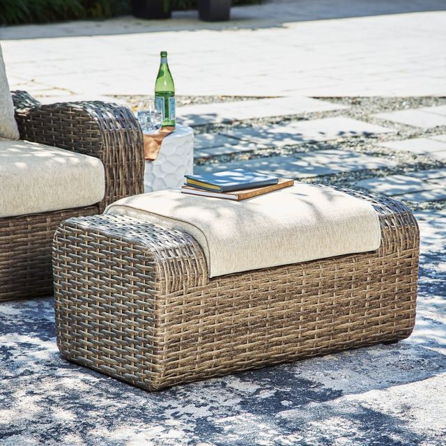 Signature Design by Ashley® Sandy Bloom Beige Outdoor Ottoman with Cushion 2