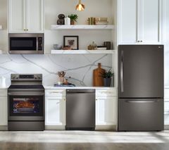 LG 4 Piece Kitchen Package with a 25.50 cu.ft. Total Capacity Bottom Mount Refrigerator PLUS a FREE 10 PC Luxury Cookware Set