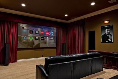 Luxury home theater with Control4 interface on screen