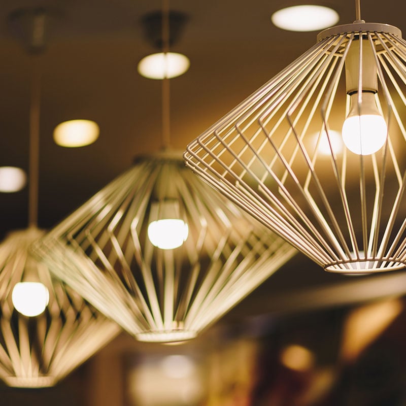 Gold geometric caged lighting fixtures