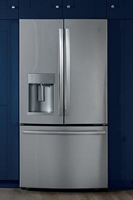 A kitchen refrigerator and stovetop.